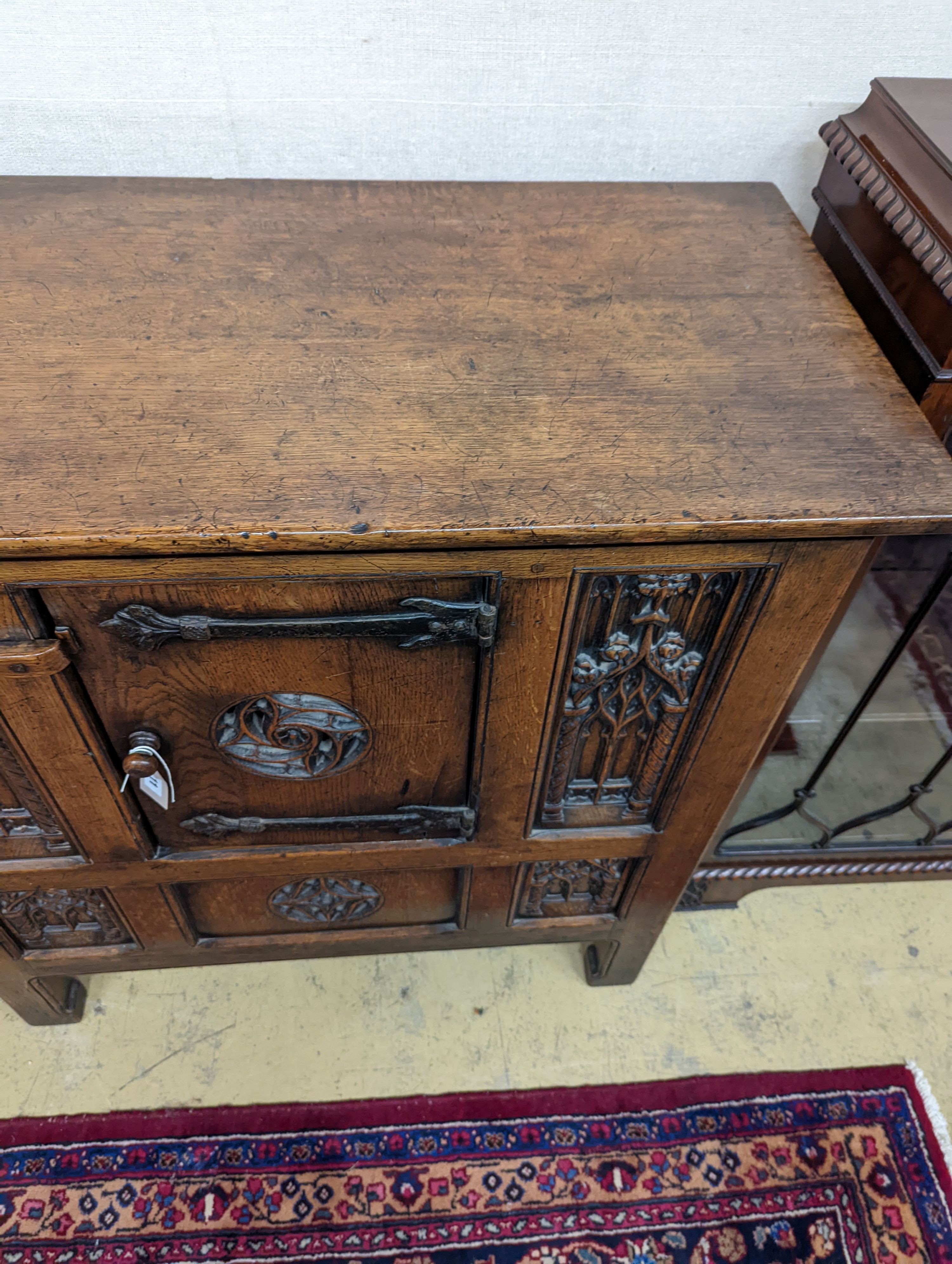 A Garrard Radiogram in a Gothic revival carved oak case. W-98cm,D-49cm, H-101cm.